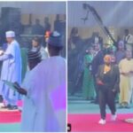 Reactions as President Buhari stares at Teni after she received her award