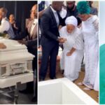 Sammie Okposo’s wife Ozioma weeps uncontrollably as her husband is finally buried